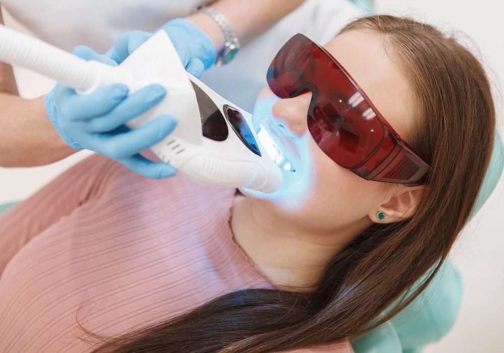 A girl wearing safety eye mask during her laser teeth whitening at Camellia polyclinic